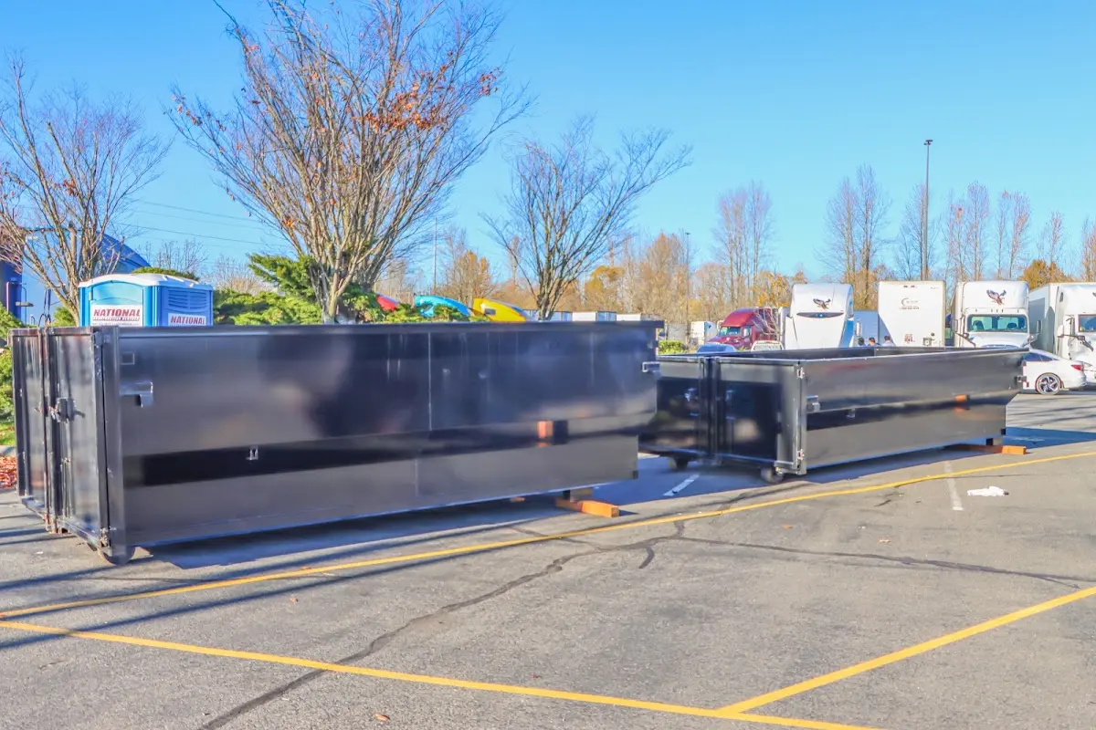 Professional dumpster rental service with roll-off container on residential driveway in Villa Hills